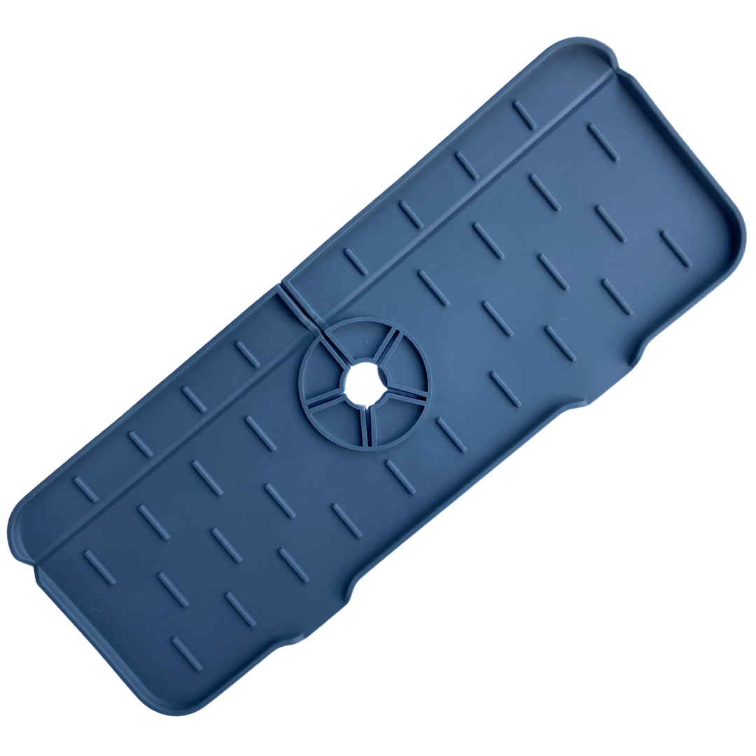 Silicone sink mat and draining mat around tap, designed to prevent water splashes, keep countertops dry, and fit most faucet sizes with a non-slip, flexible design.
