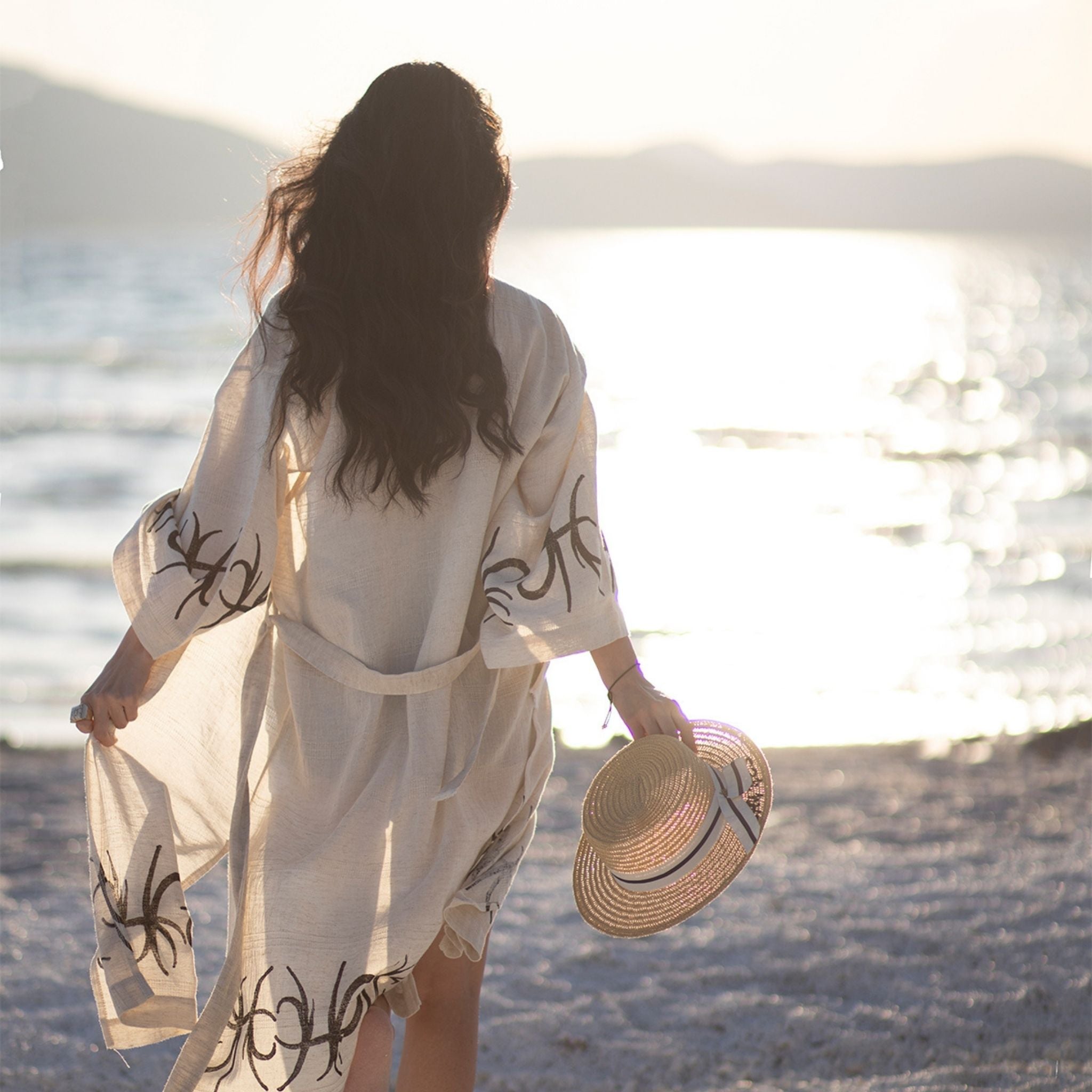 Unisex linen and hemp kimono robe with hand-block printed boho pattern, styled as beach cover-up 